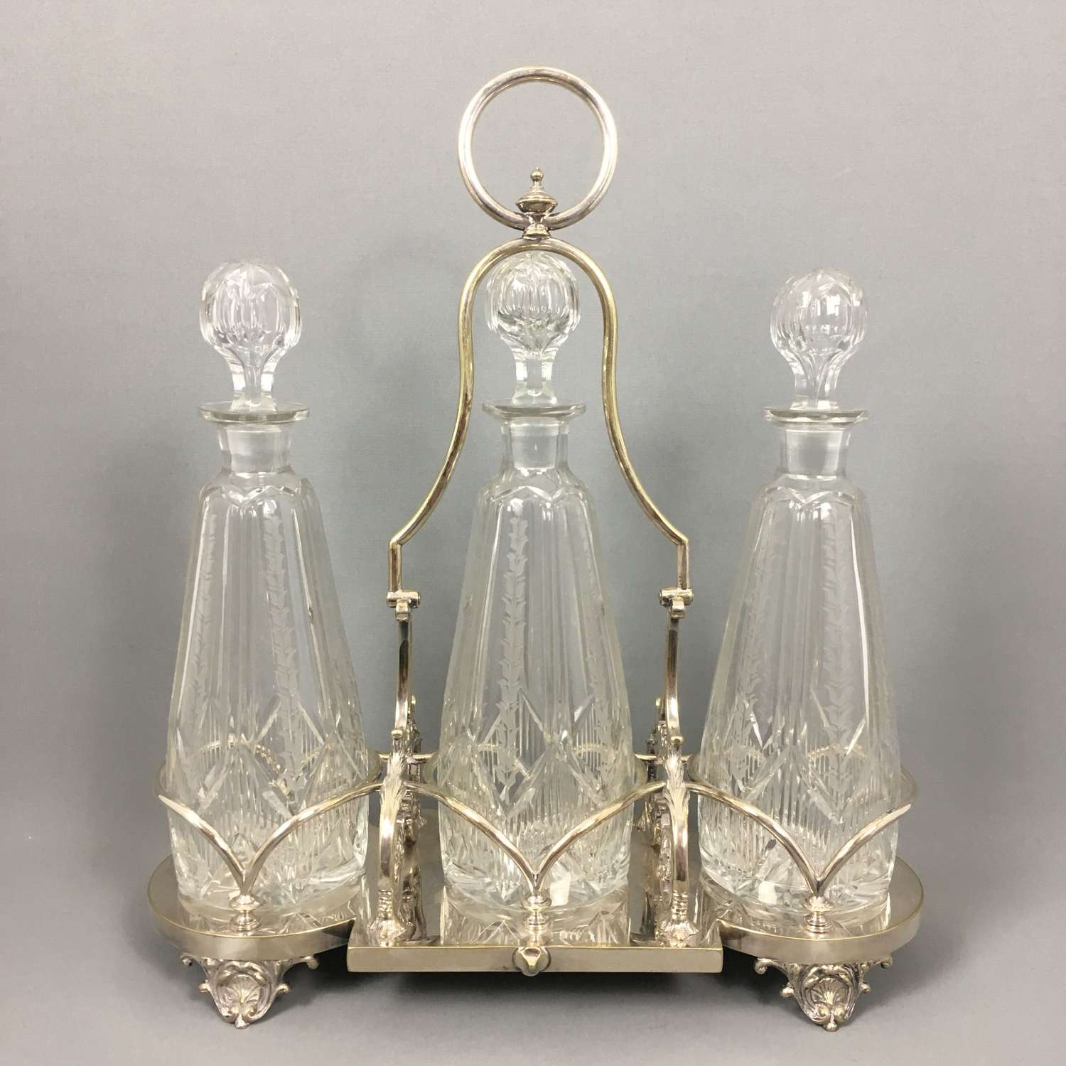 Antique trio bottle glass tantalus. W8497