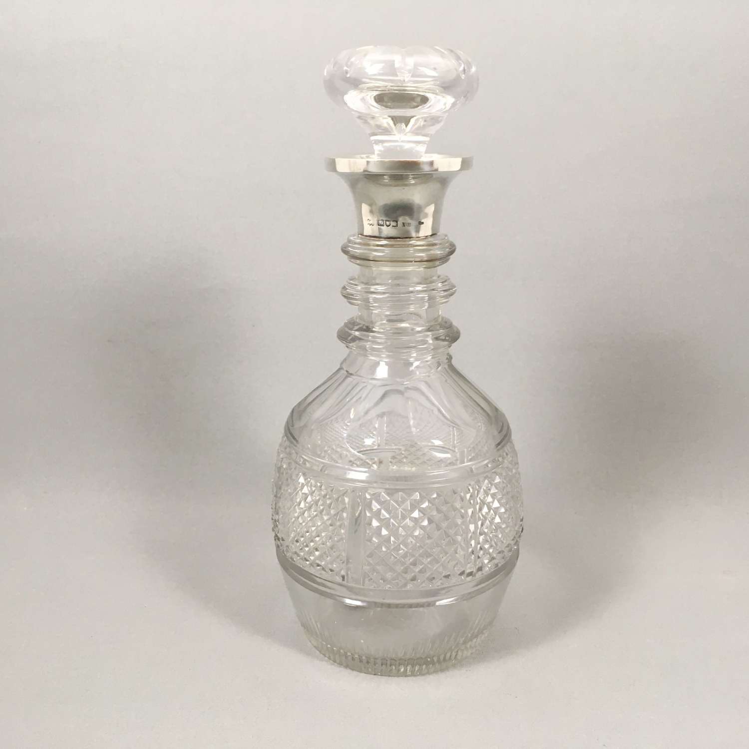 Antique cut glass silver rimmed Decanter. W8498