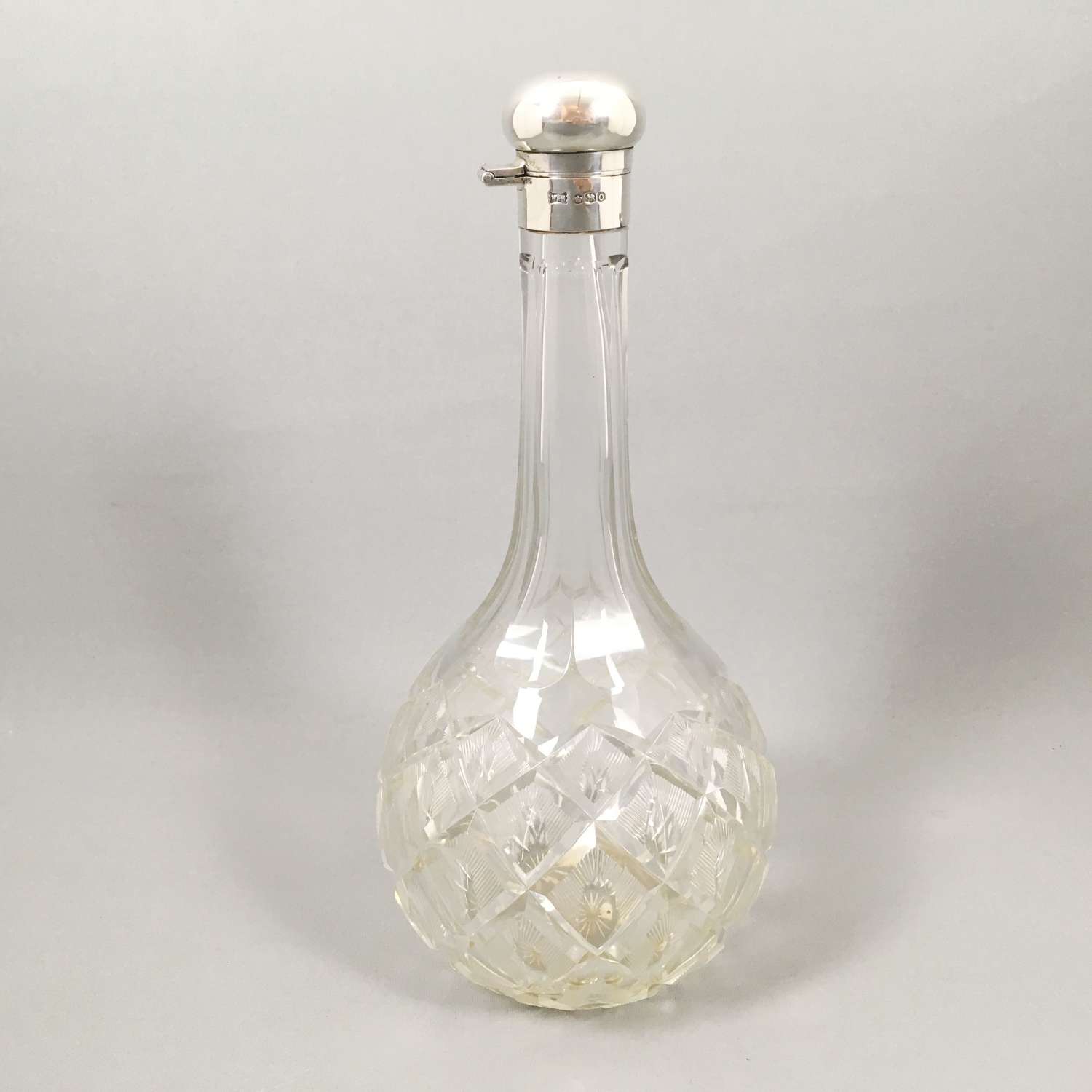 Vintage silver topped cut globe decanter. W8499