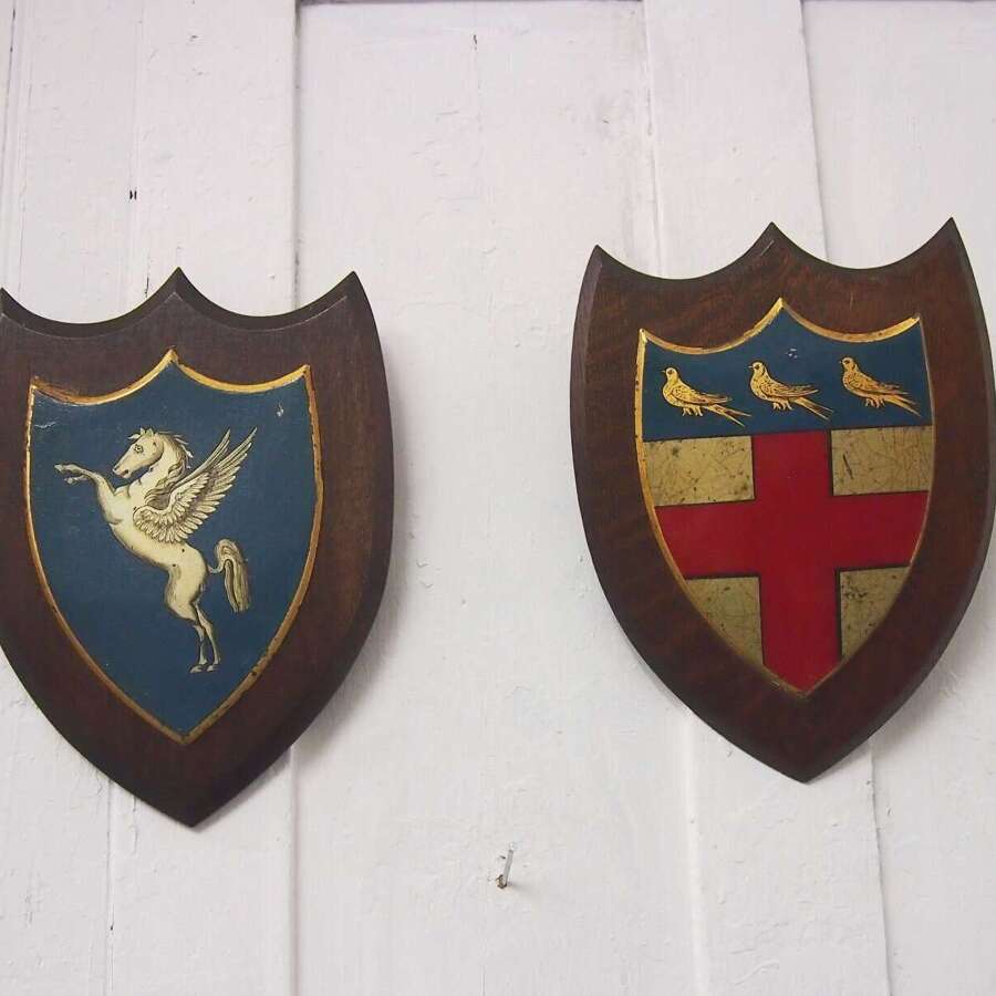 Two vintage Metal Crests W8710